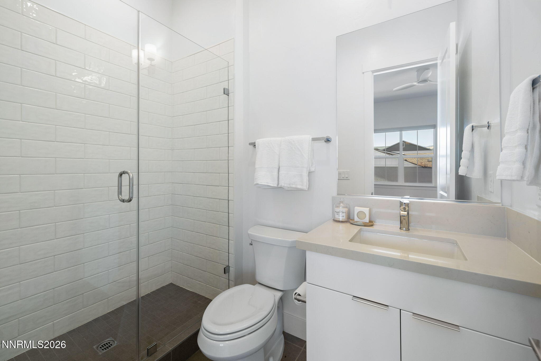 5406 Side Saddle Trail Reno, NV 89511 - Photo 30 of 39 a bathroom with a sink toilet vanity and shower