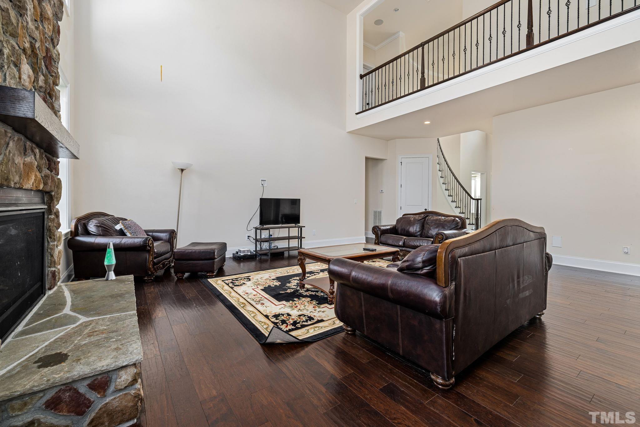 2808 Spring Shade Road Apex, NC 27523 - Photo 12 of 34 a living room with furniture a flat screen tv and a window