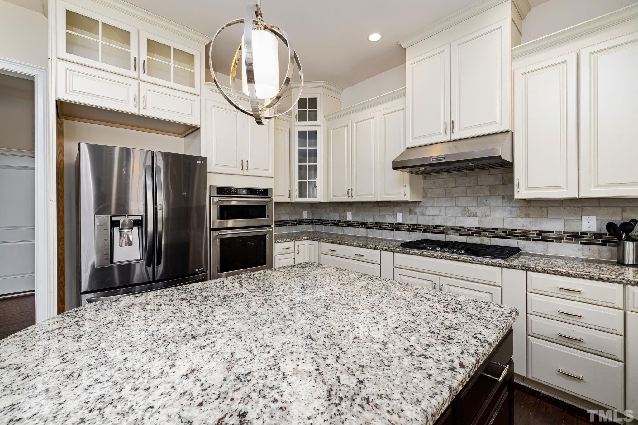 2808 Spring Shade Road Apex, NC 27523 - Photo 16 of 34 a kitchen with stainless steel appliances granite countertop a refrigerator and a sink