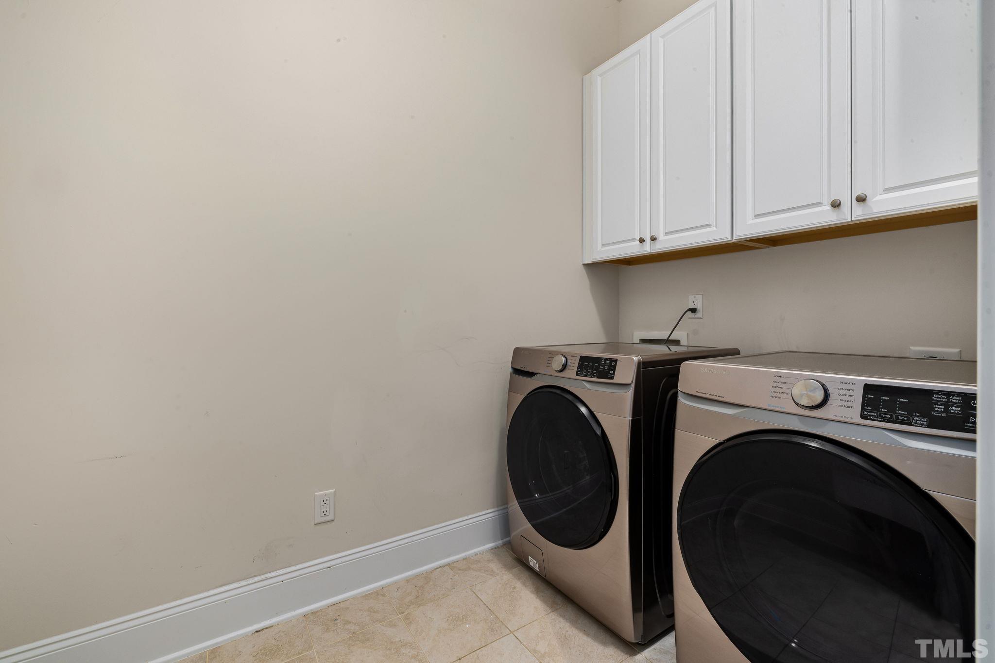 2808 Spring Shade Road Apex, NC 27523 - Photo 17 of 34 a utility room with dryer and washer