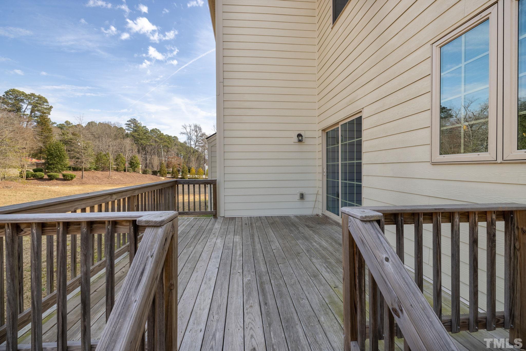2808 Spring Shade Road Apex, NC 27523 - Photo 32 of 34 a balcony with wooden floor and city view