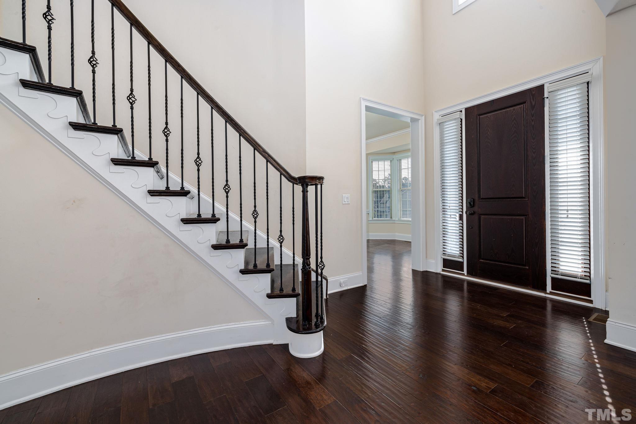 2808 Spring Shade Road Apex, NC 27523 - Photo 4 of 34 a view of an entryway with wooden floor and stairs