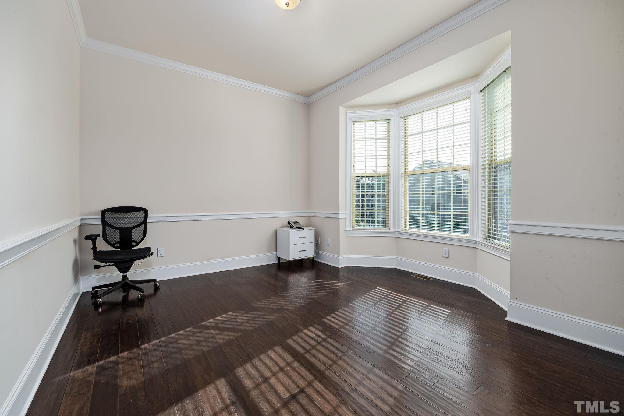 2808 Spring Shade Road Apex, NC 27523 - Photo 5 of 34 a view of workspace with wooden floor and fan