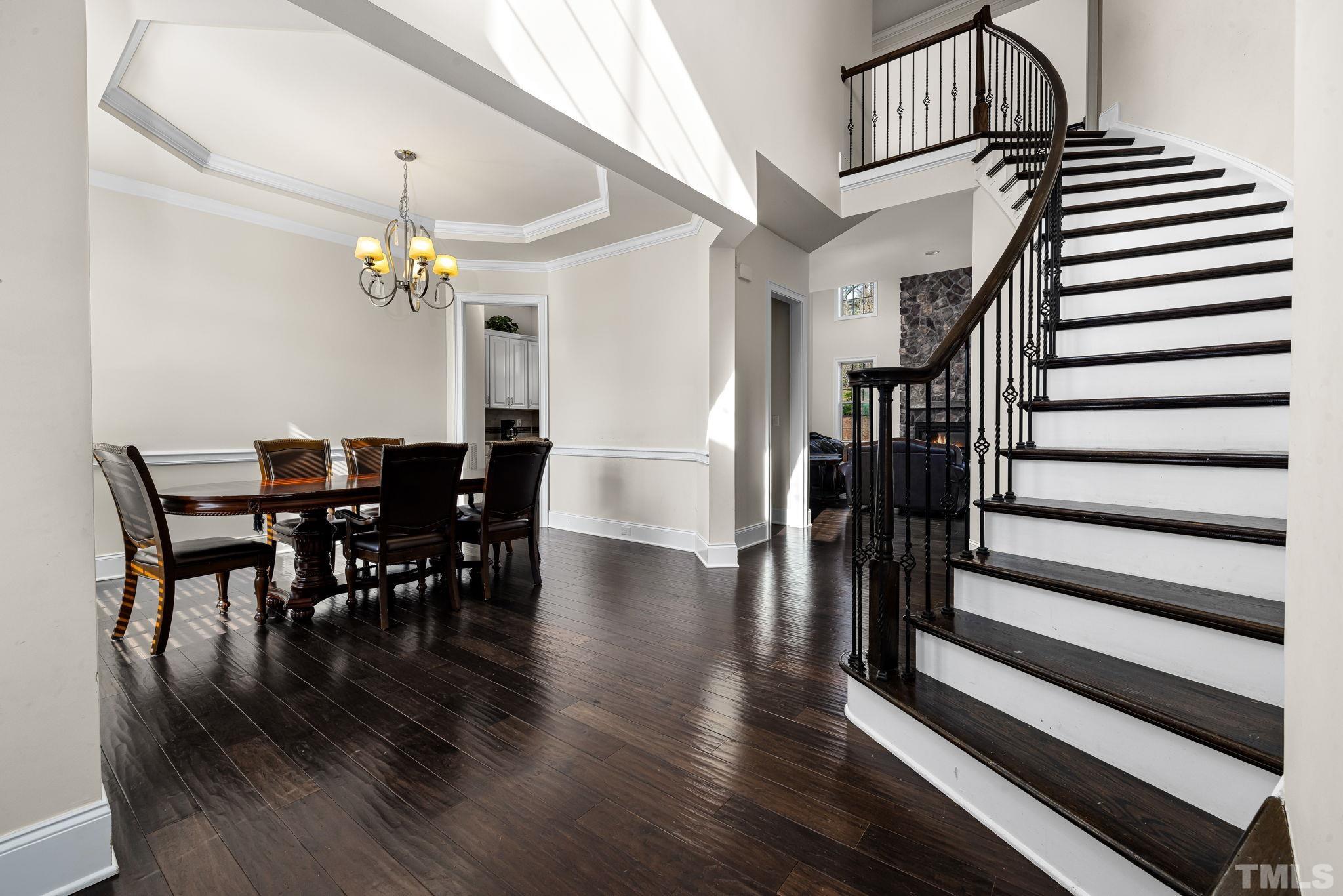 2808 Spring Shade Road Apex, NC 27523 - Photo 6 of 34 a view of a dining room with furniture and wooden floor