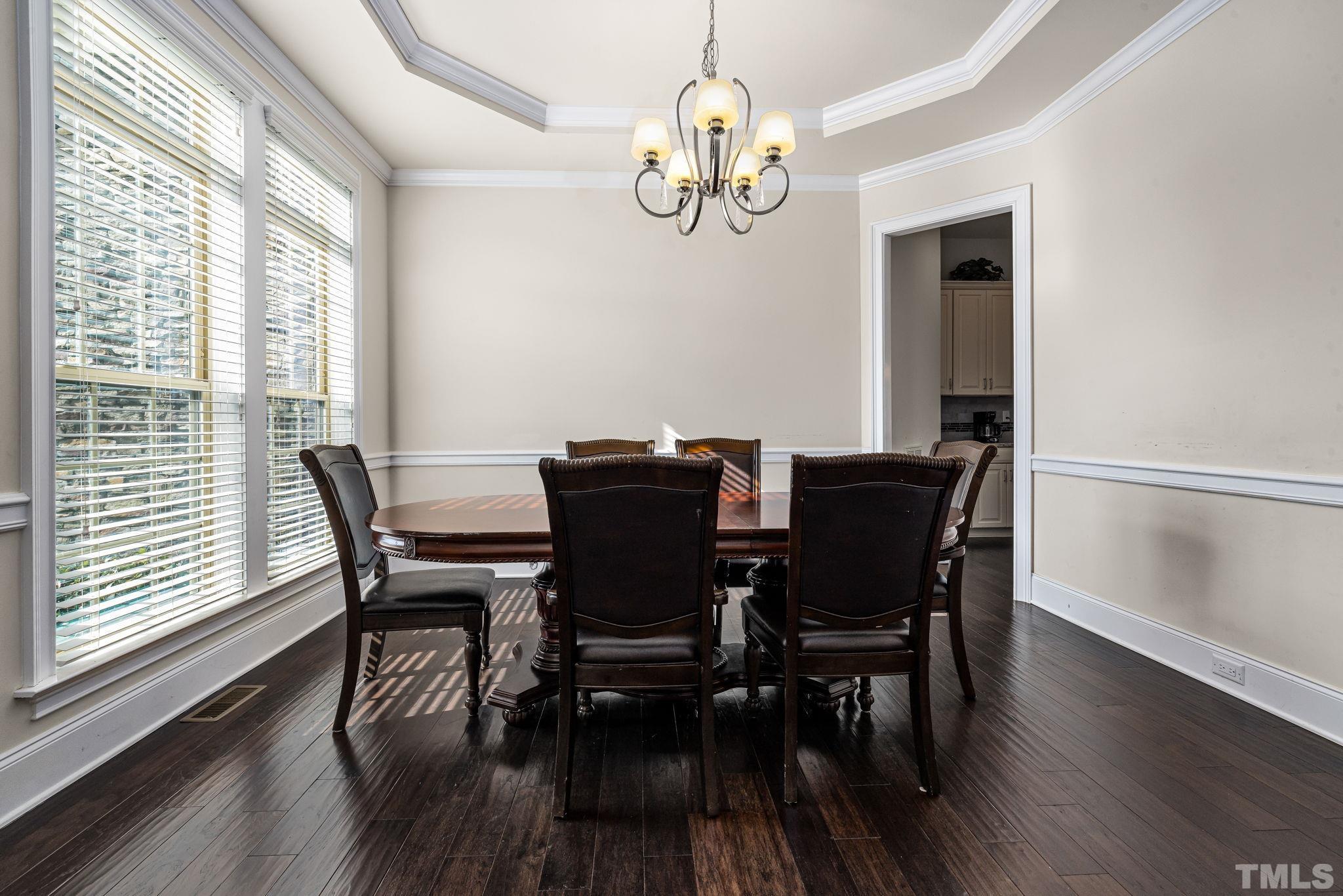 2808 Spring Shade Road Apex, NC 27523 - Photo 7 of 34 a view of a dining room with furniture window and wooden floor