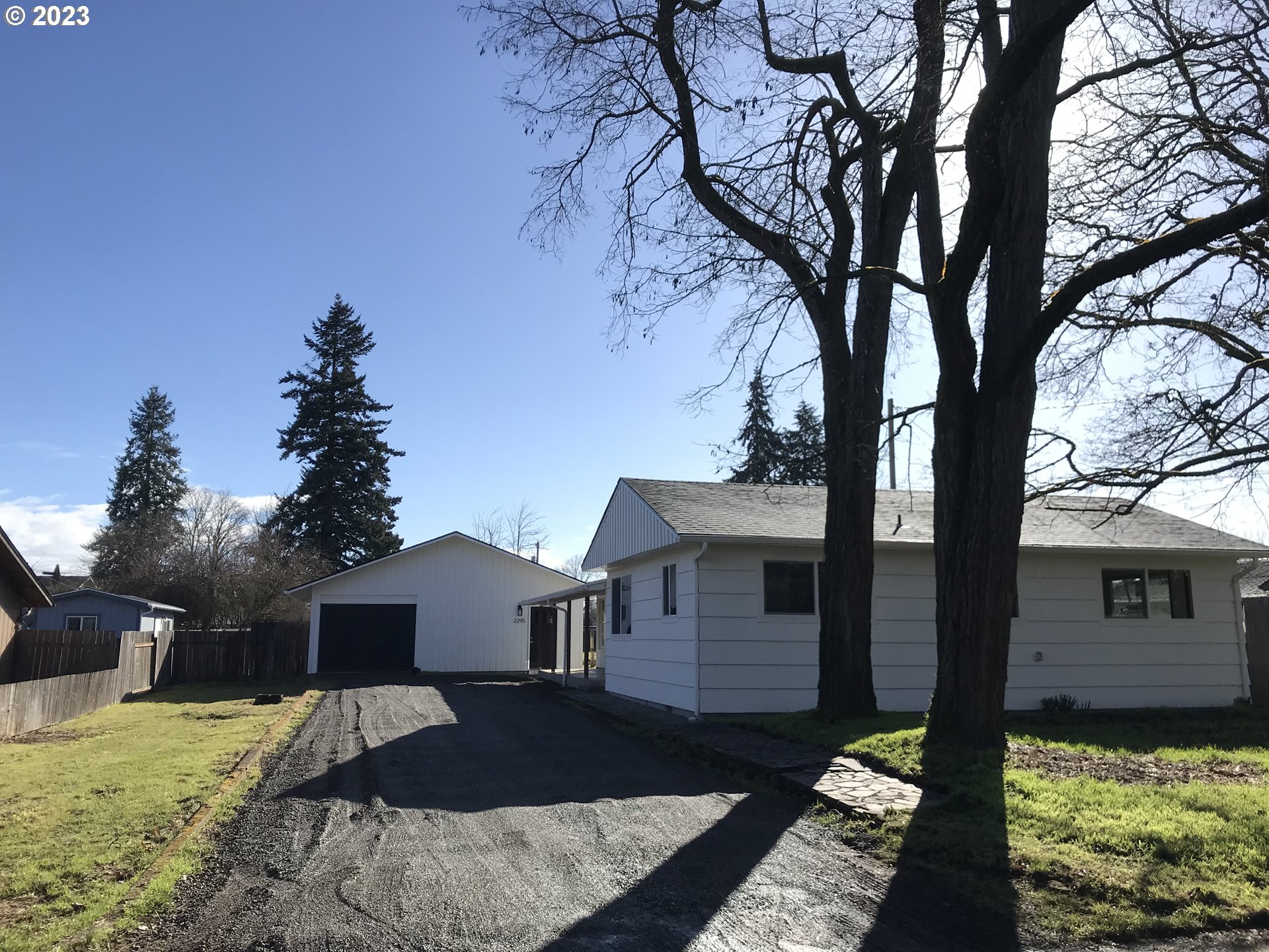 2295 Dakota Street Eugene, OR 97402 - Photo 14 of 17 a front view of a house with a yard