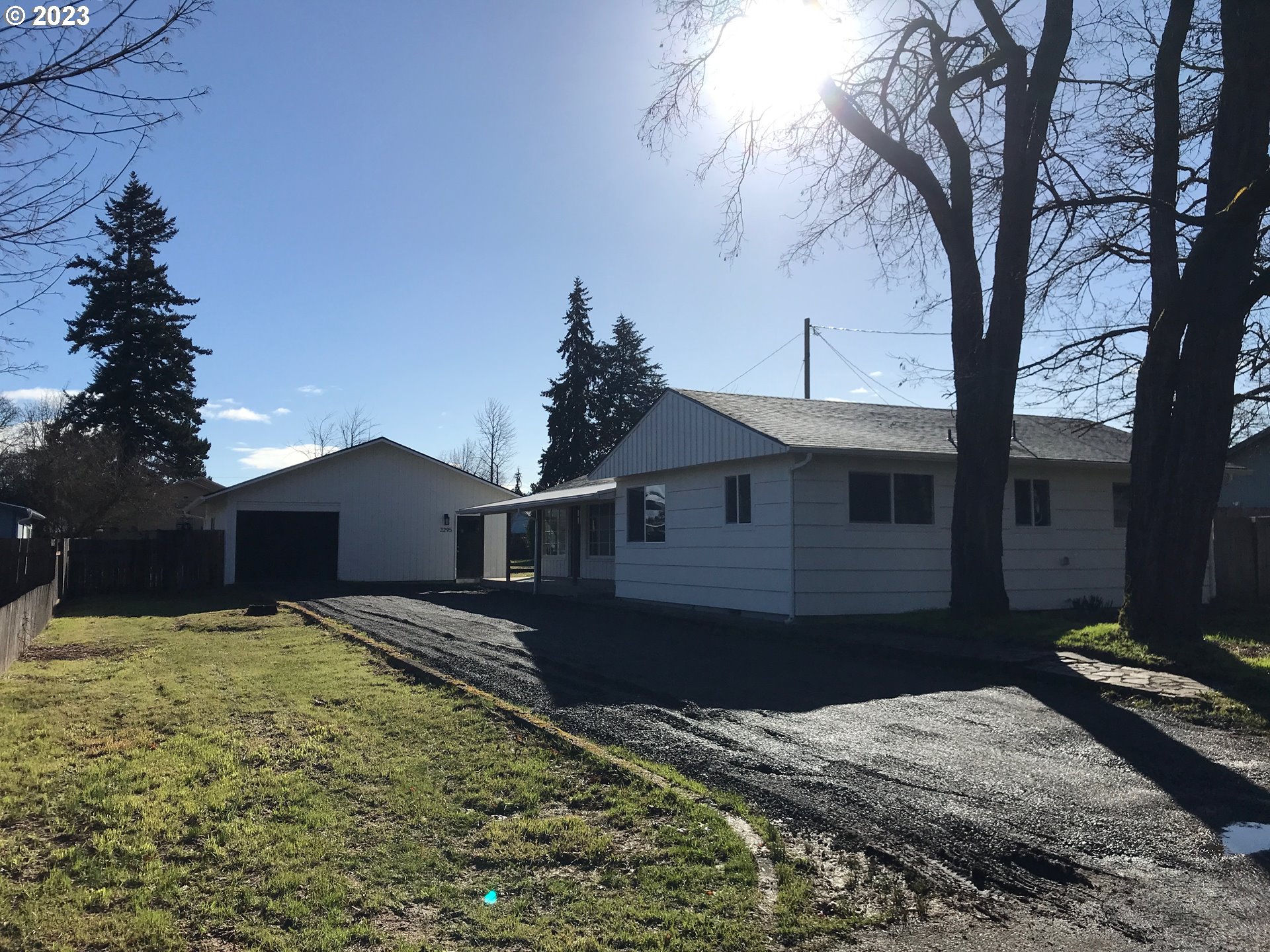 2295 Dakota Street Eugene, OR 97402 - Photo 5 of 17 a front view of a house with a yard
