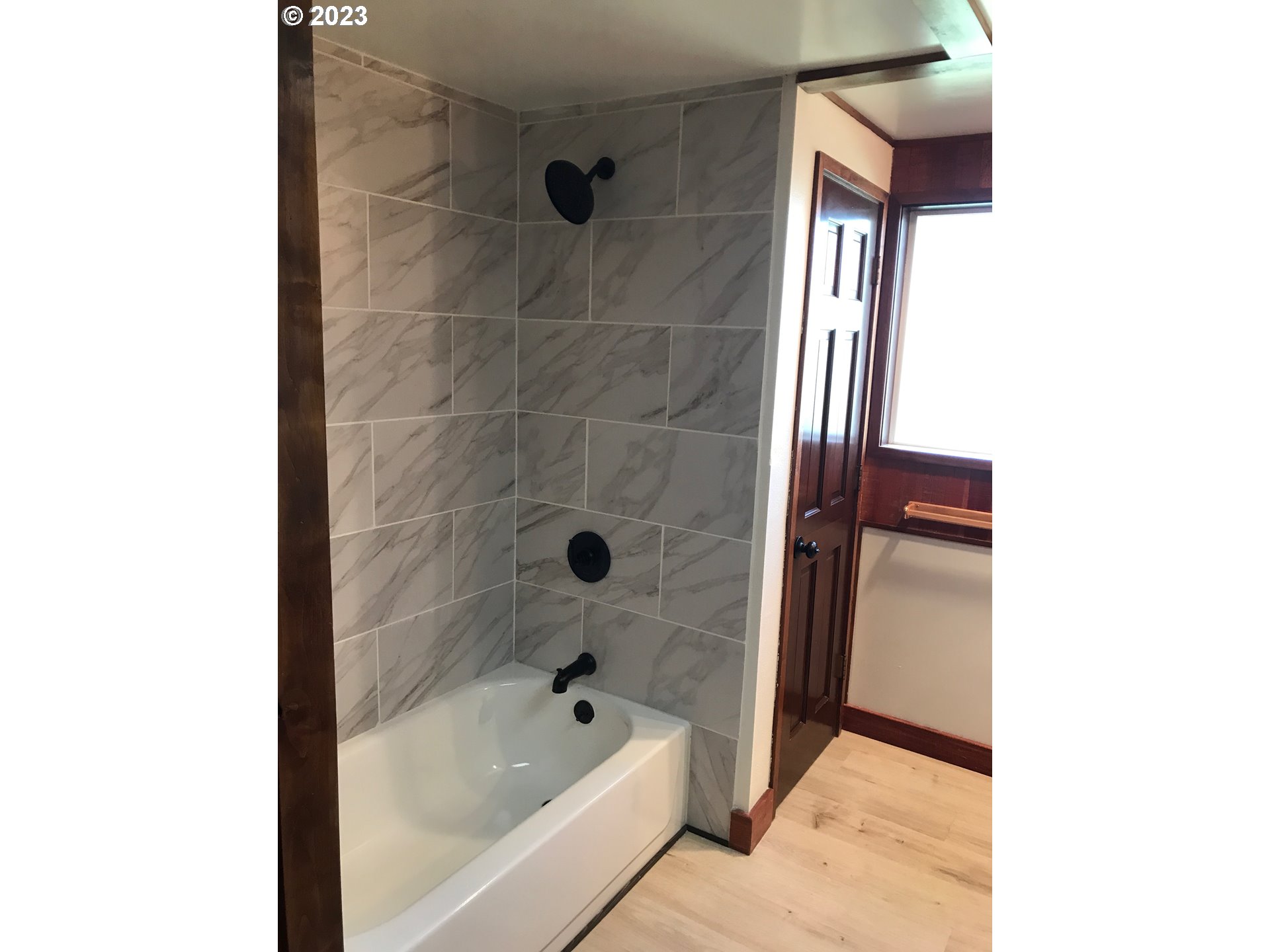 2295 Dakota Street Eugene, OR 97402 - Photo 7 of 17 a bathroom with a bathtub and shower