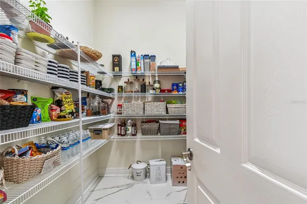 a view of a living room and chandelier