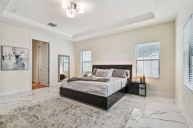 a living room with fireplace furniture and a large window