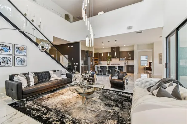 a bedroom with a bed and painting on the wall