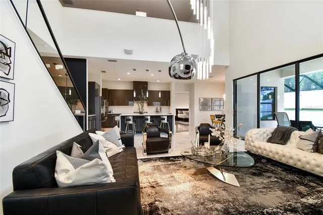 a bathroom with a granite countertop sink a large mirror and a shower