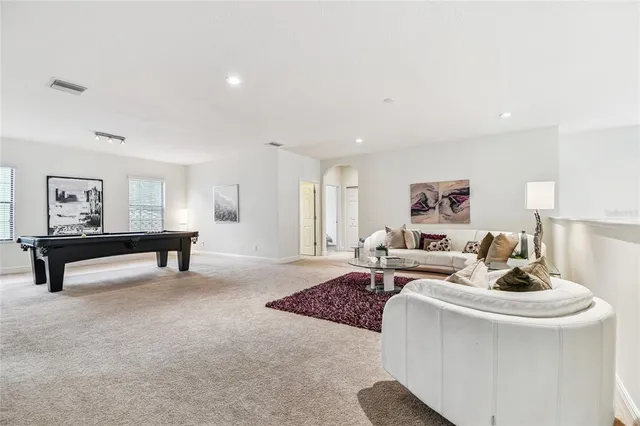 a bedroom with a bed and a potted plant