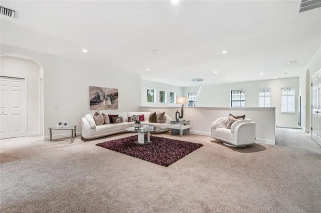 a bedroom with a bed and a flat tv screen