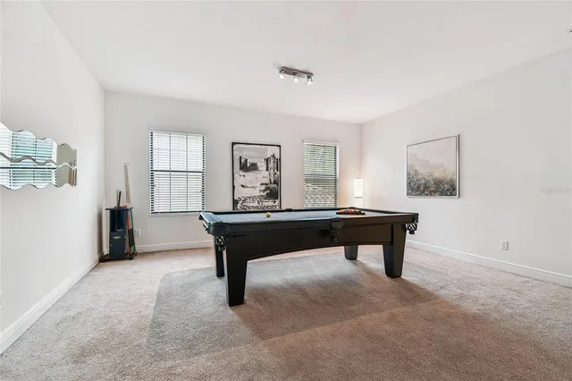 a bathroom with a double vanity sink a mirror and a bathtub