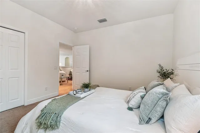 a view of a patio with table and chairs and potted plants