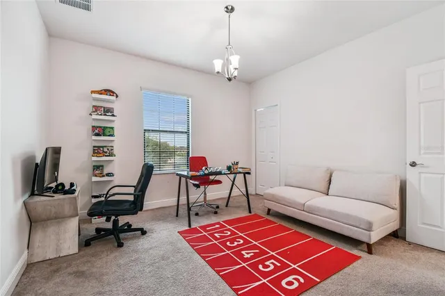 an aerial view of a house with outdoor space and lake view