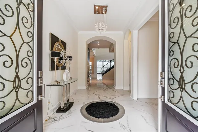a kitchen with stainless steel appliances a sink a stove and a wooden floors