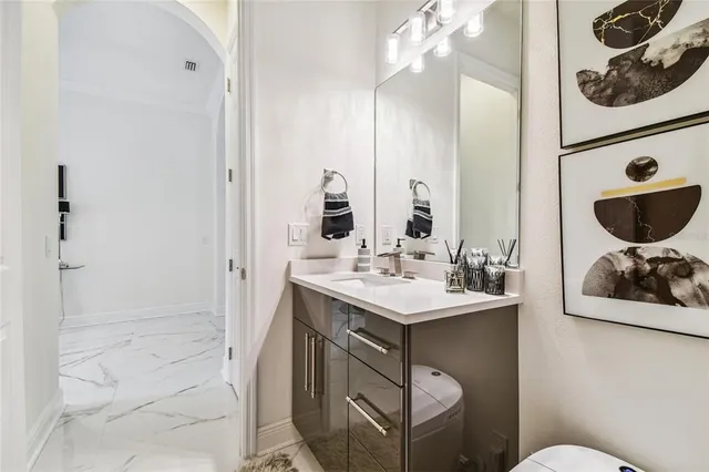 a kitchen with kitchen island a sink appliances and cabinets