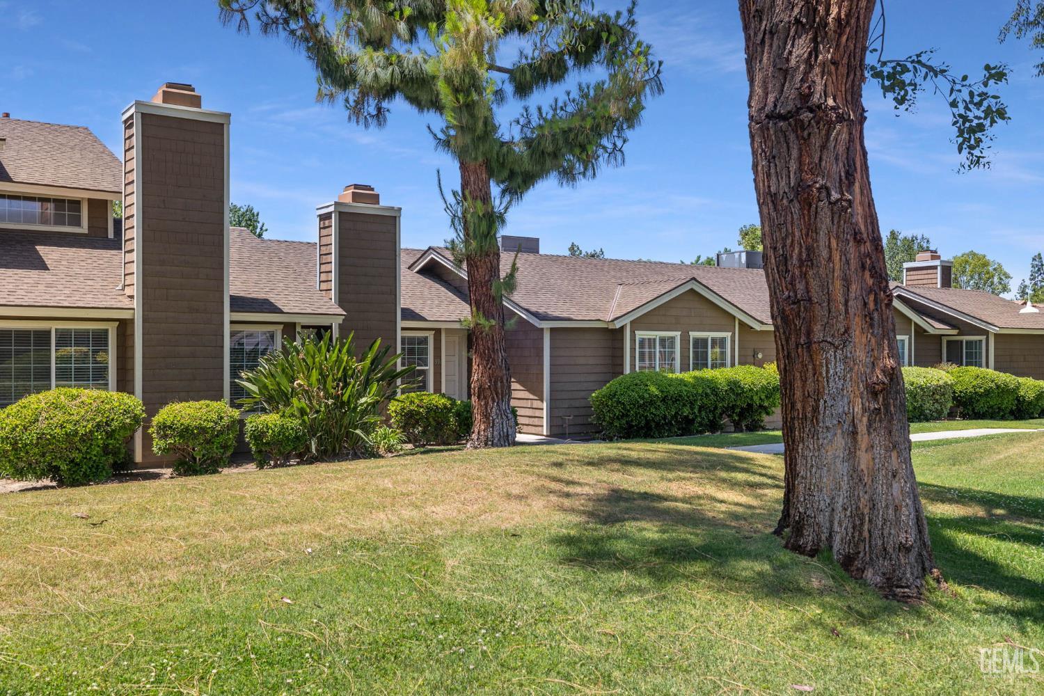 Undisclosed Address Bakersfield, CA 93309 - Photo 2 of 42 a front view of a house with a yard