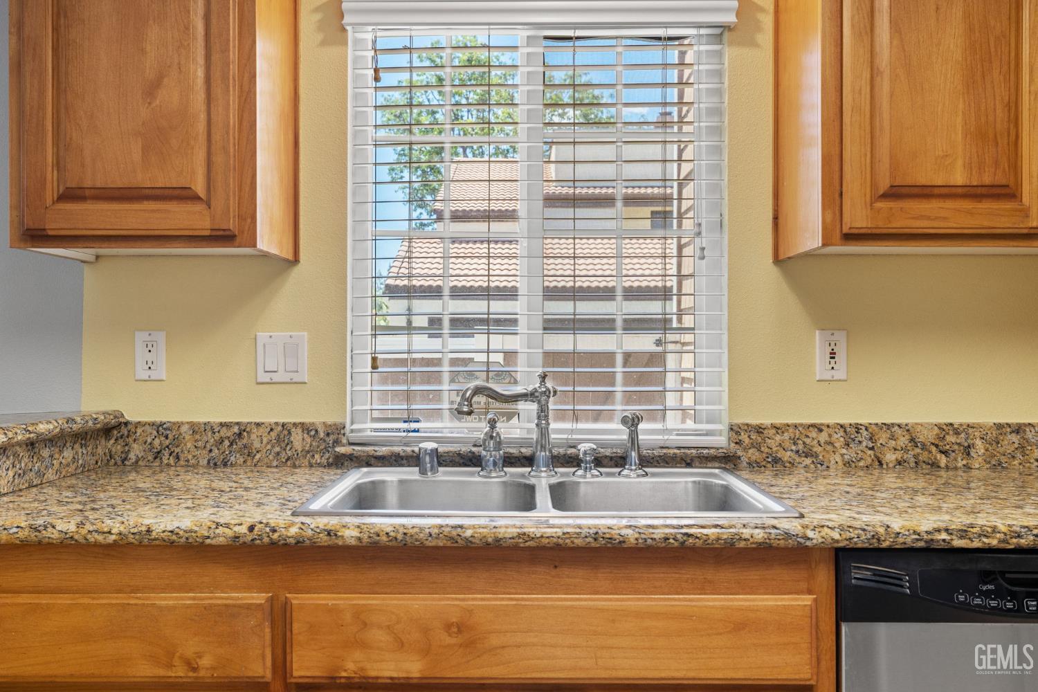 Undisclosed Address Bakersfield, CA 93309 - Photo 24 of 42 a view of a granite counter top a sink and dishwasher