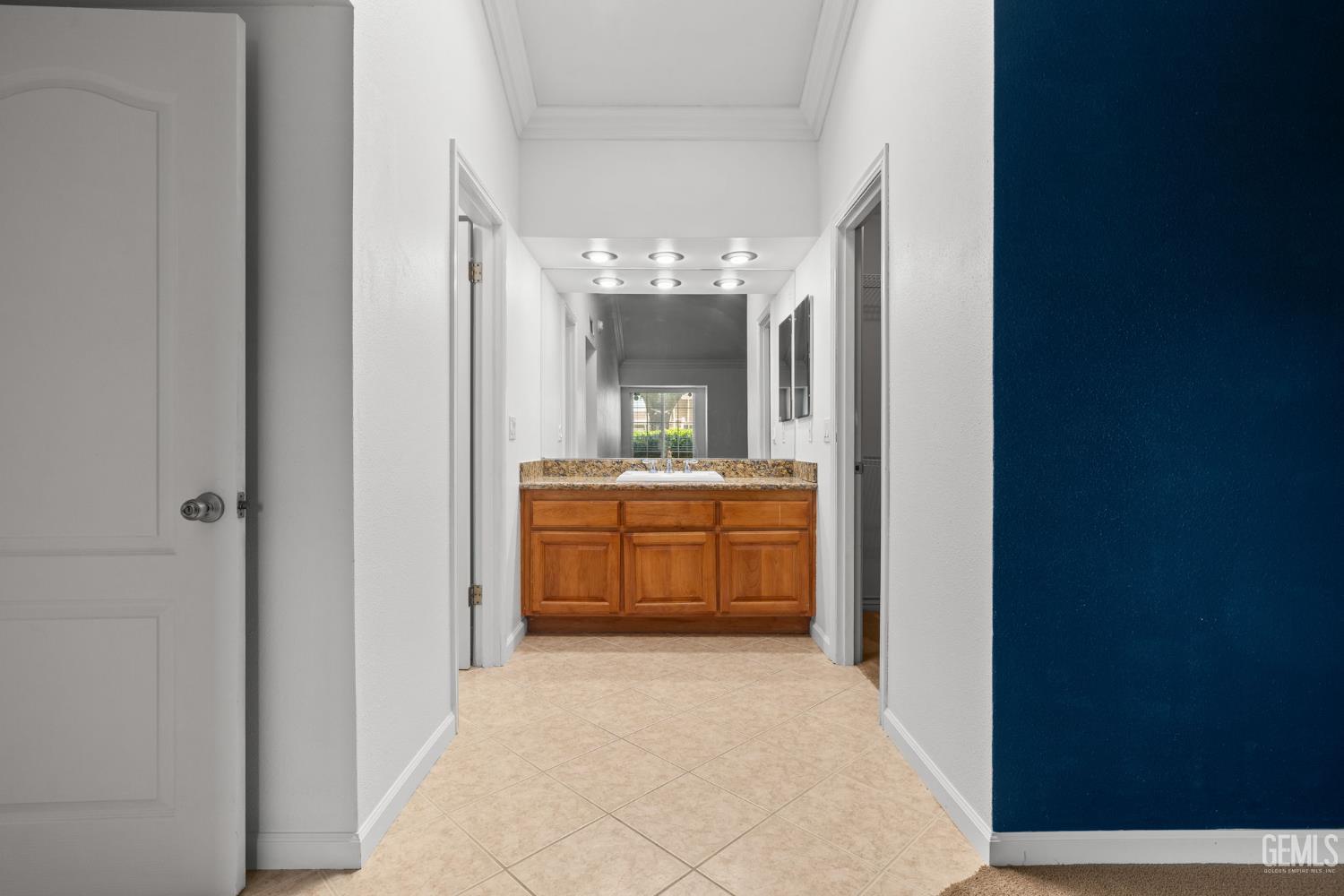 Undisclosed Address Bakersfield, CA 93309 - Photo 30 of 42 a bathroom with a double vanity sink and a mirror