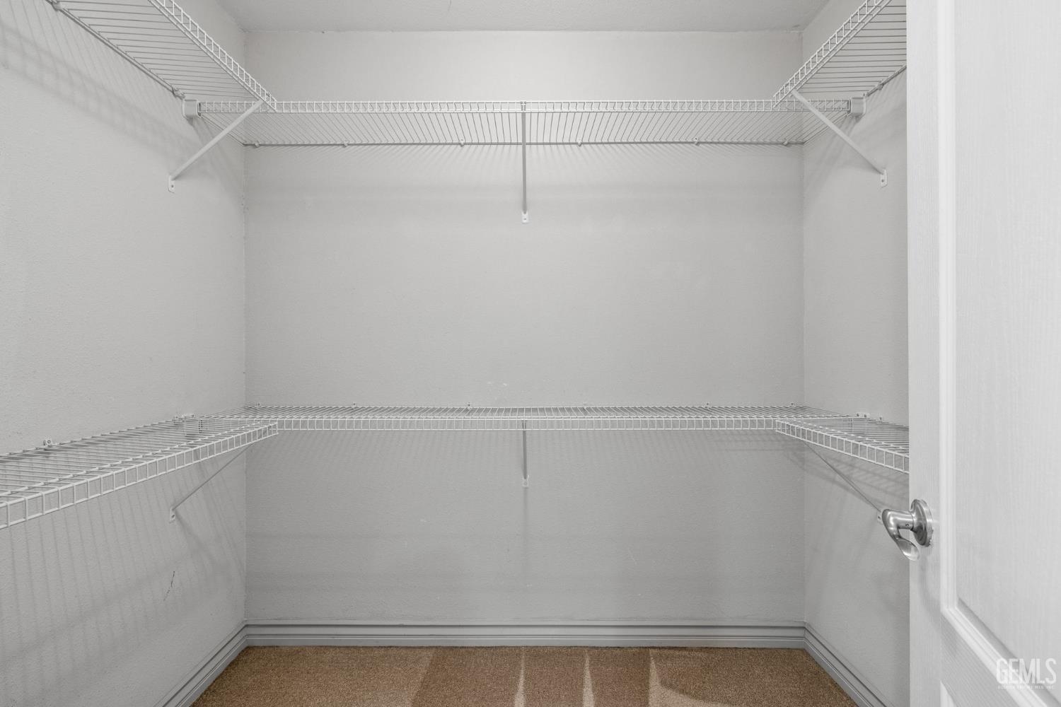 Undisclosed Address Bakersfield, CA 93309 - Photo 32 of 42 a view of a room with racks on the wall