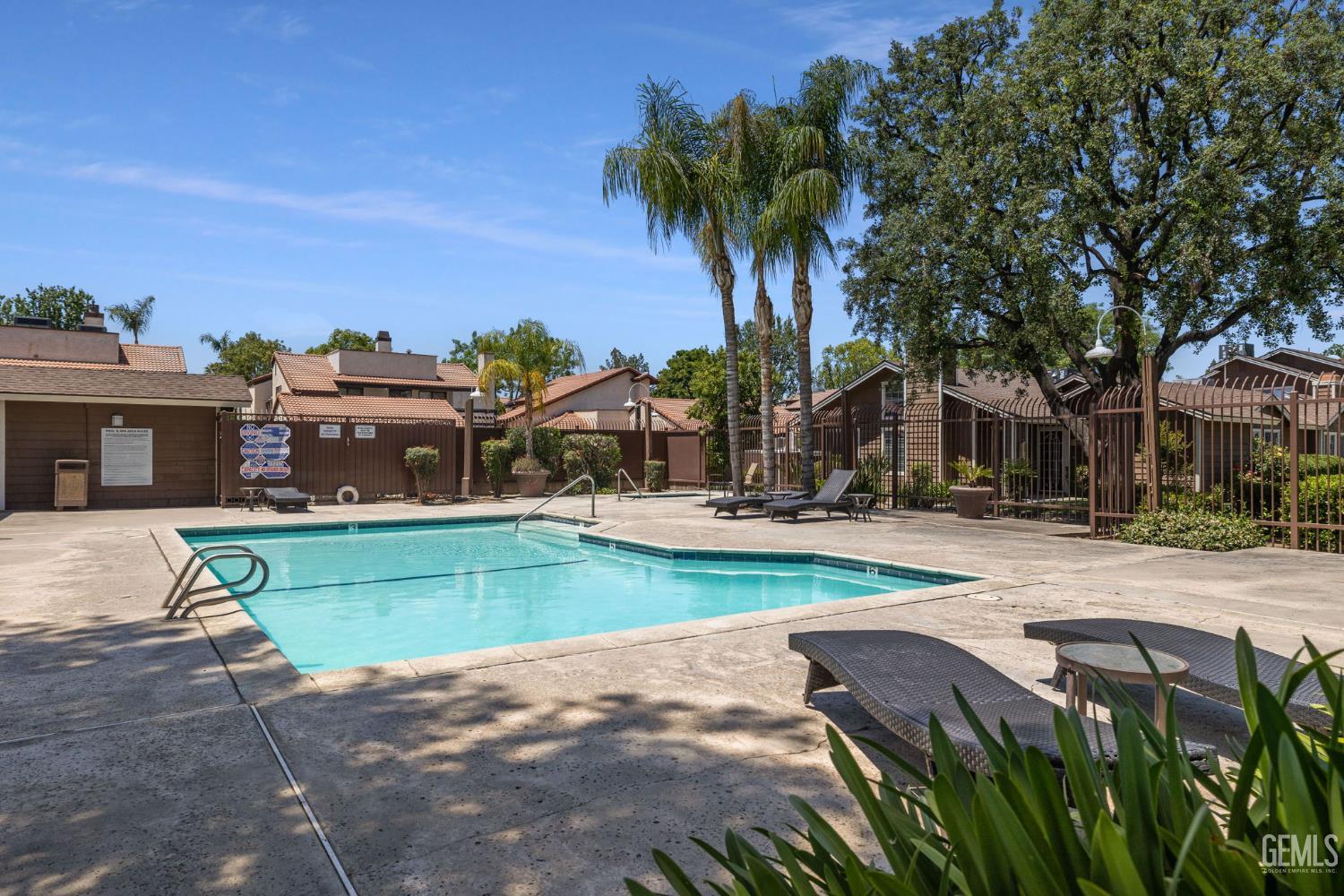 Undisclosed Address Bakersfield, CA 93309 - Photo 41 of 42 a view of a house with garden and a tree