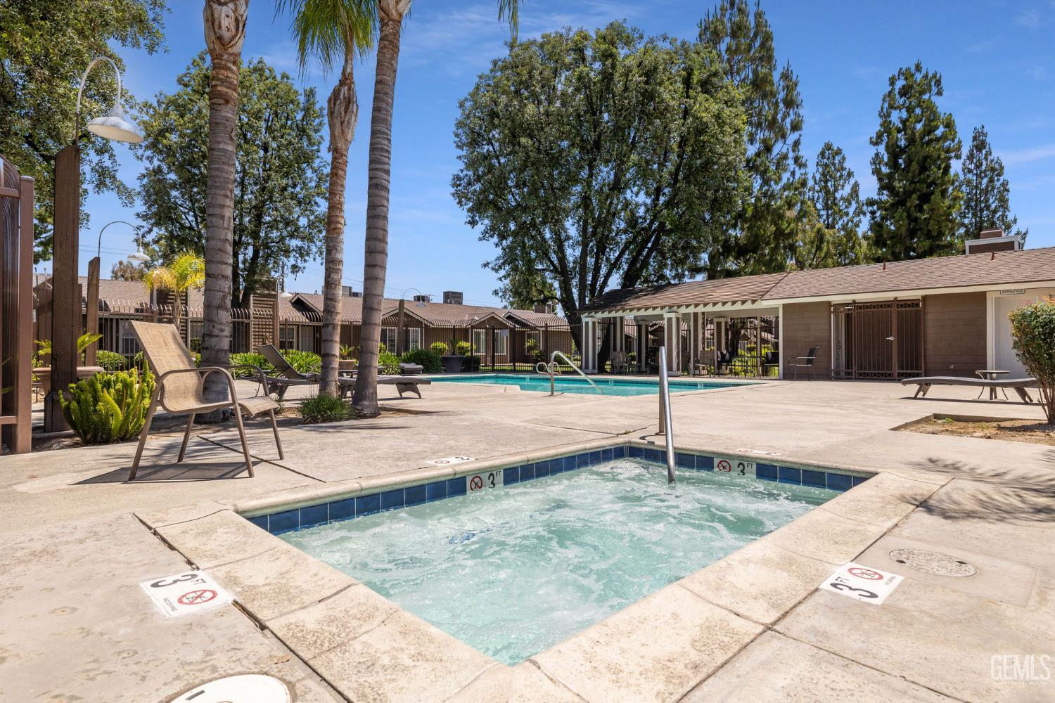 Undisclosed Address Bakersfield, CA 93309 - Photo 42 of 42 a view of a house with swimming pool and sitting area