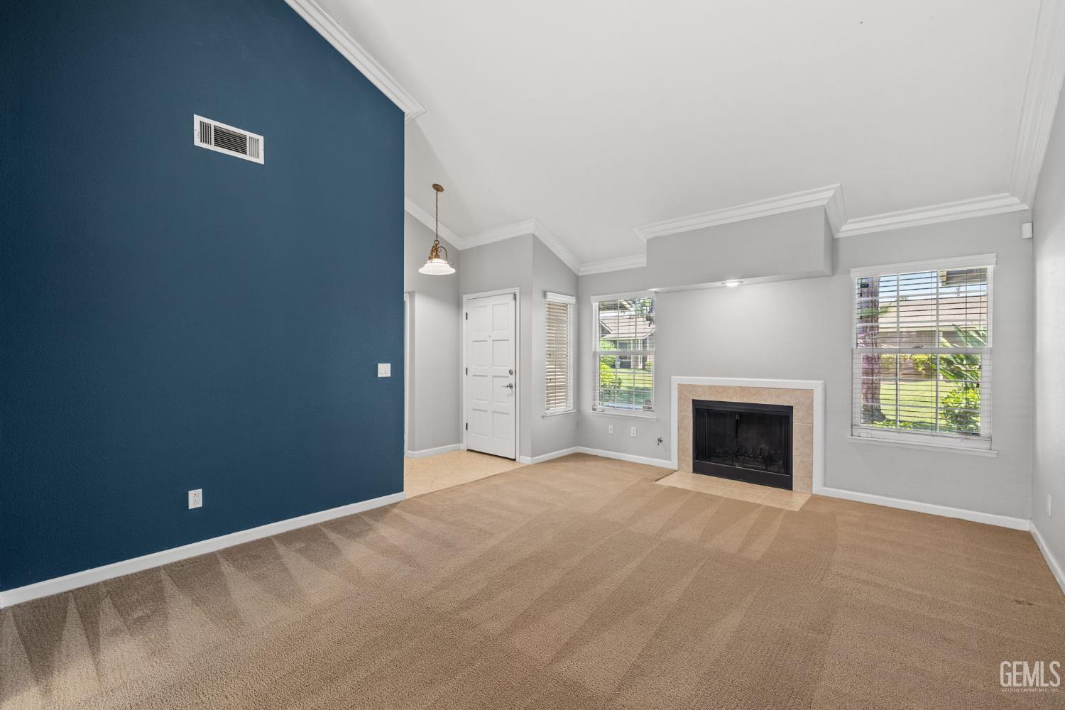 Undisclosed Address Bakersfield, CA 93309 - Photo 10 of 42 a view of empty room with a fireplace