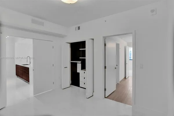 a view of storage and utility room with washer and dryer