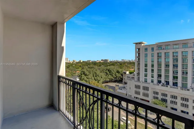 a front view of a building with a garden