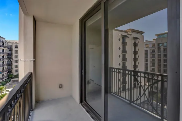 a view of a patio with couches and a fire pit