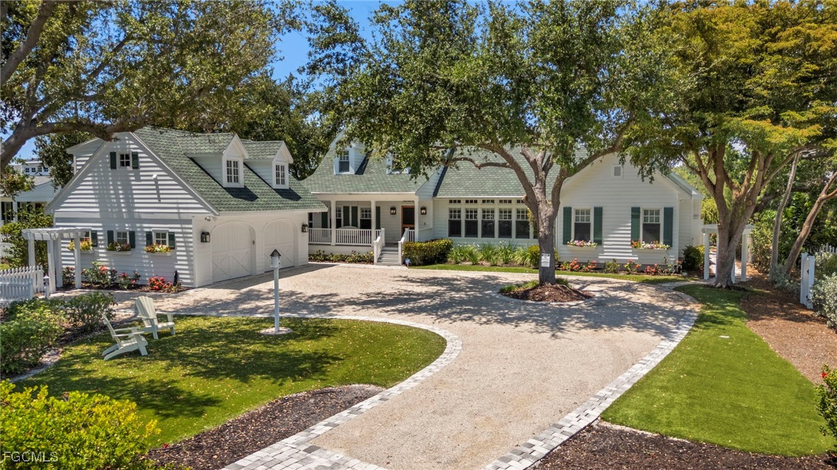 1517 Sand Castle Road Sanibel, FL 33957 - Photo 1 of 50 a view of a house with swimming pool and sitting area
