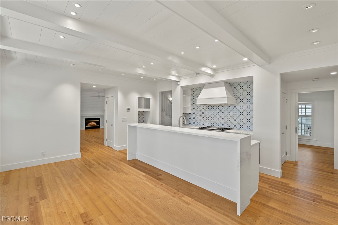 1517 Sand Castle Road Sanibel, FL 33957 - Photo 17 of 50 a large kitchen with stainless steel appliances granite countertop a large counter top and a wooden floors