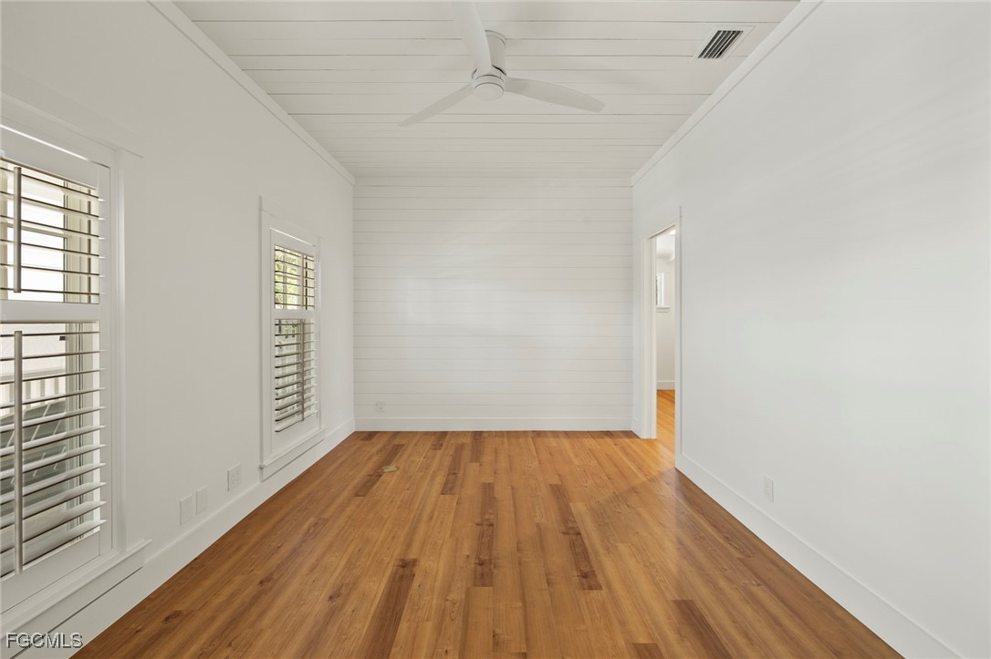1517 Sand Castle Road Sanibel, FL 33957 - Photo 19 of 50 a view of wooden floor in an empty room with a window