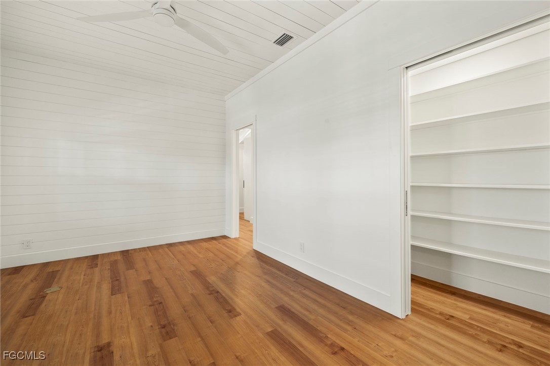 1517 Sand Castle Road Sanibel, FL 33957 - Photo 20 of 50 a view of an empty room with wooden floor and a window
