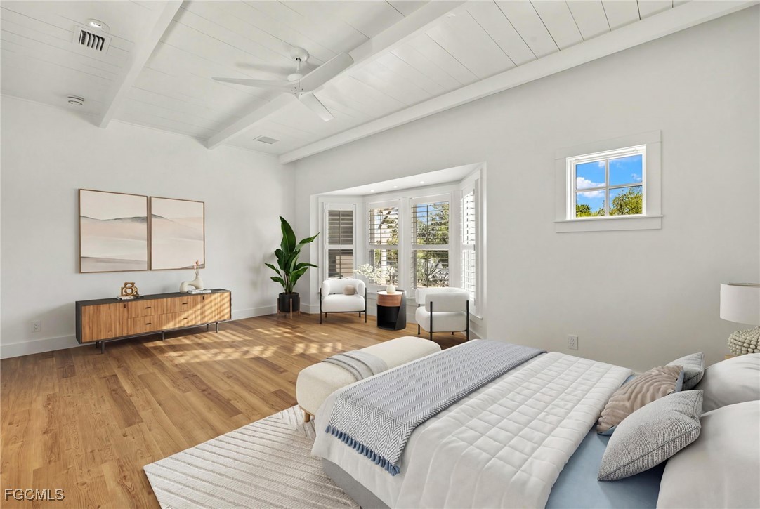 1517 Sand Castle Road Sanibel, FL 33957 - Photo 23 of 50 a bedroom with a bed and wooden floor