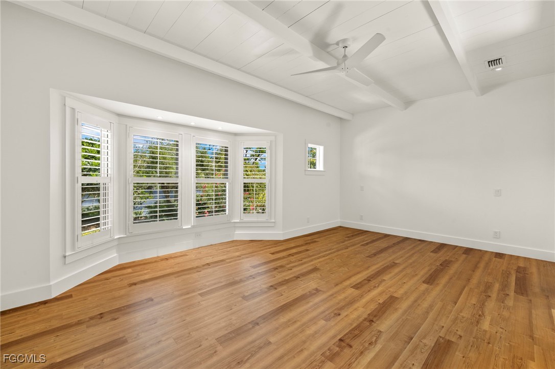 1517 Sand Castle Road Sanibel, FL 33957 - Photo 24 of 50 a view of an empty room with wooden floor and a window