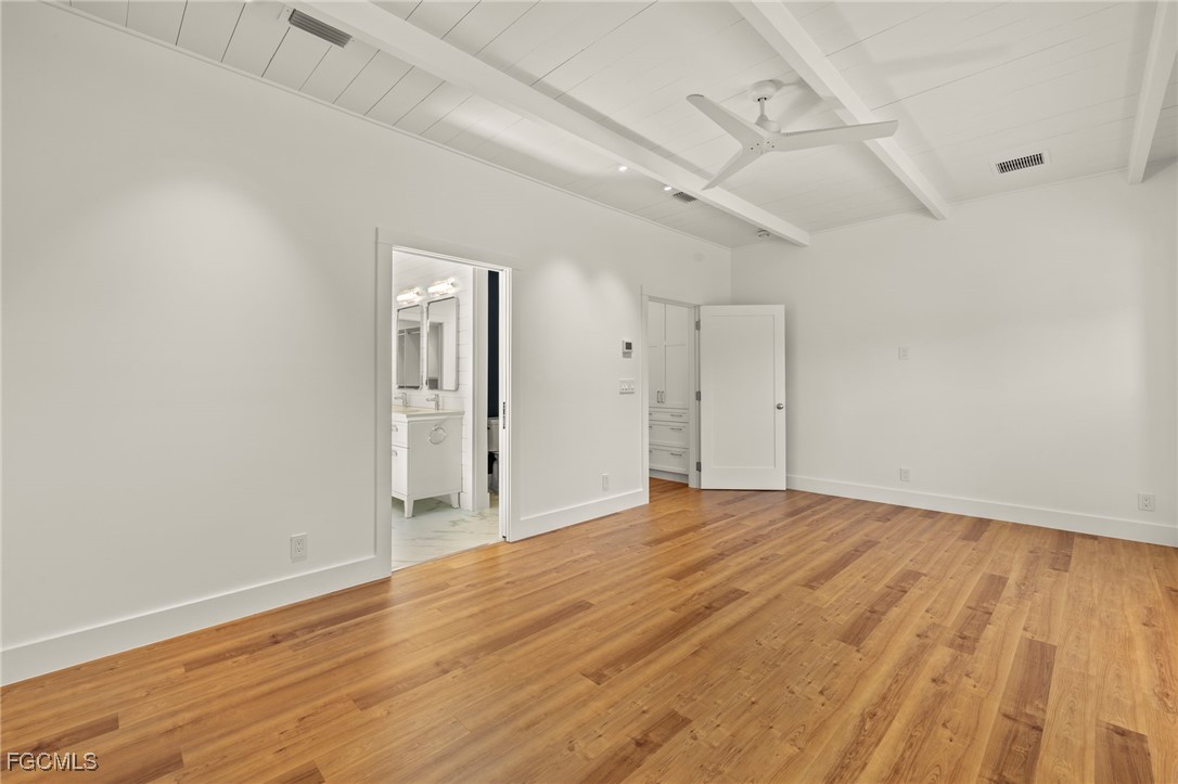1517 Sand Castle Road Sanibel, FL 33957 - Photo 25 of 50 a view of empty room with wooden floor and fan