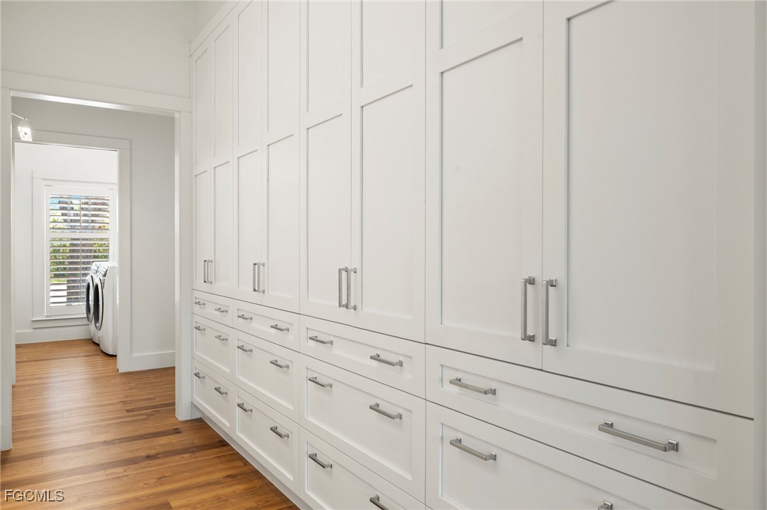1517 Sand Castle Road Sanibel, FL 33957 - Photo 30 of 50 a view of white cabinets with wooden floor