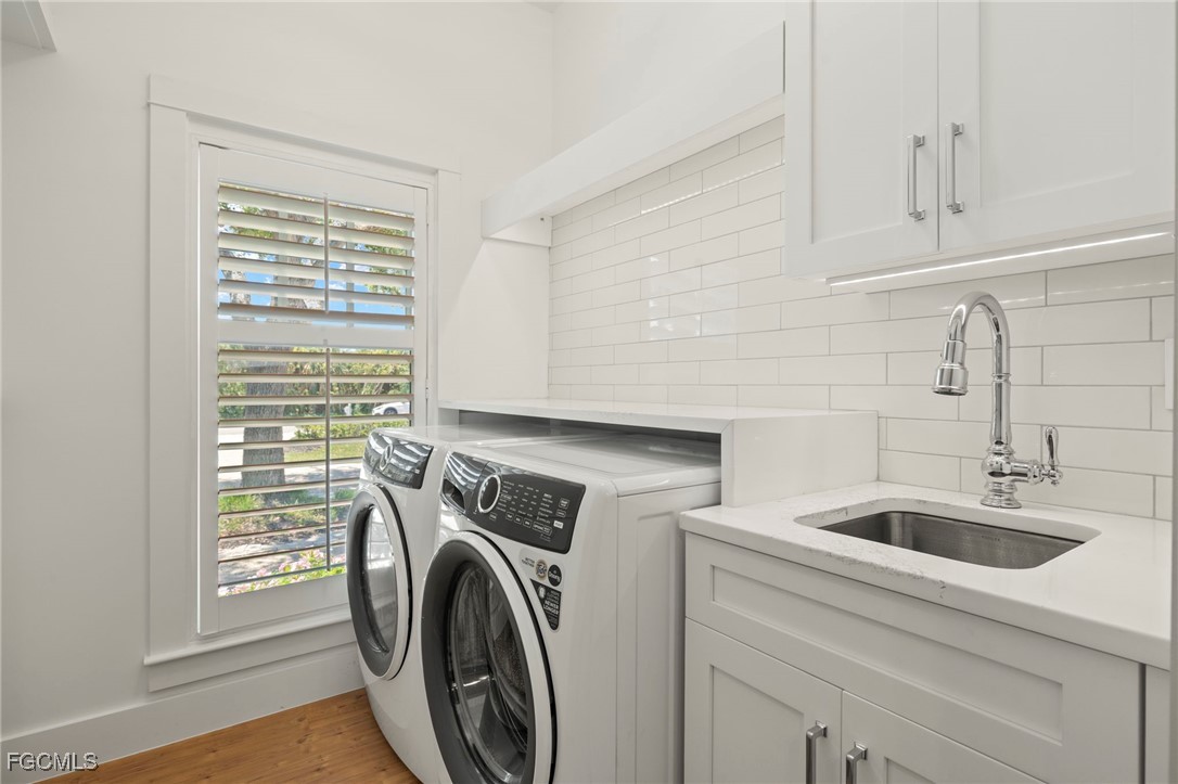 1517 Sand Castle Road Sanibel, FL 33957 - Photo 31 of 50 a utility room with dryer and washer