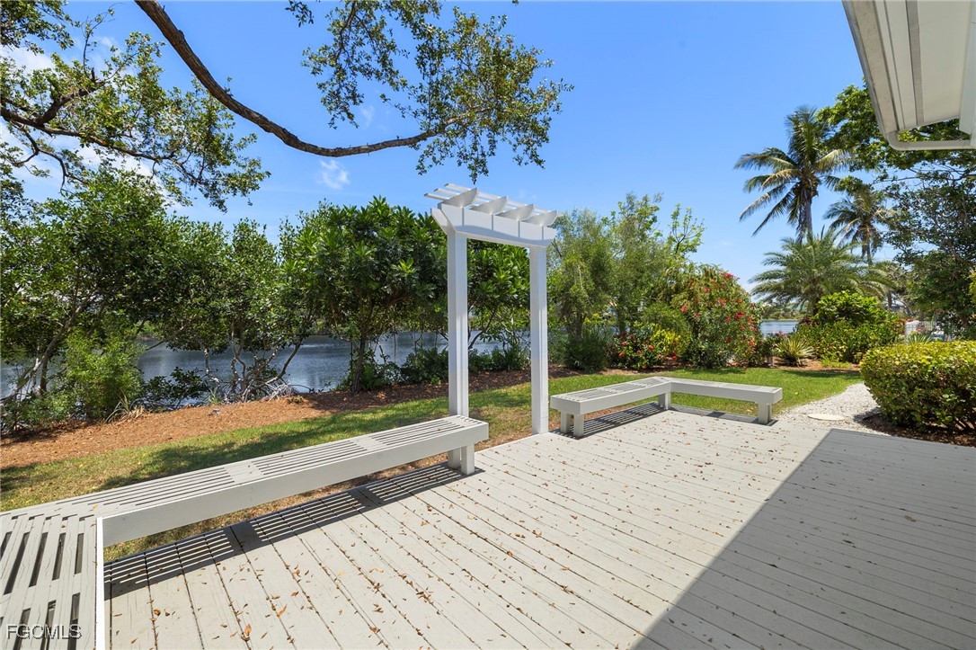 1517 Sand Castle Road Sanibel, FL 33957 - Photo 37 of 50 a view of a backyard with plants and palm tree