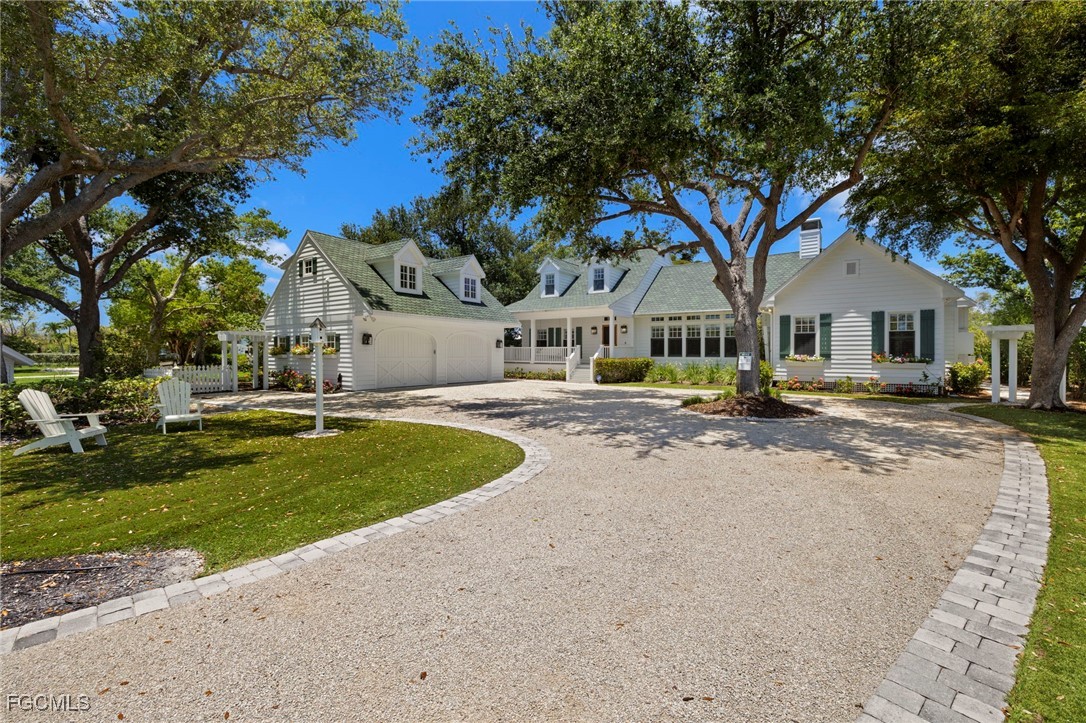 1517 Sand Castle Road Sanibel, FL 33957 - Photo 45 of 50 a house with palm tree in front of it