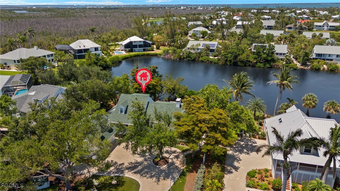 1517 Sand Castle Road Sanibel, FL 33957 - Photo 46 of 50 an aerial view of residential house with outdoor space and lake view