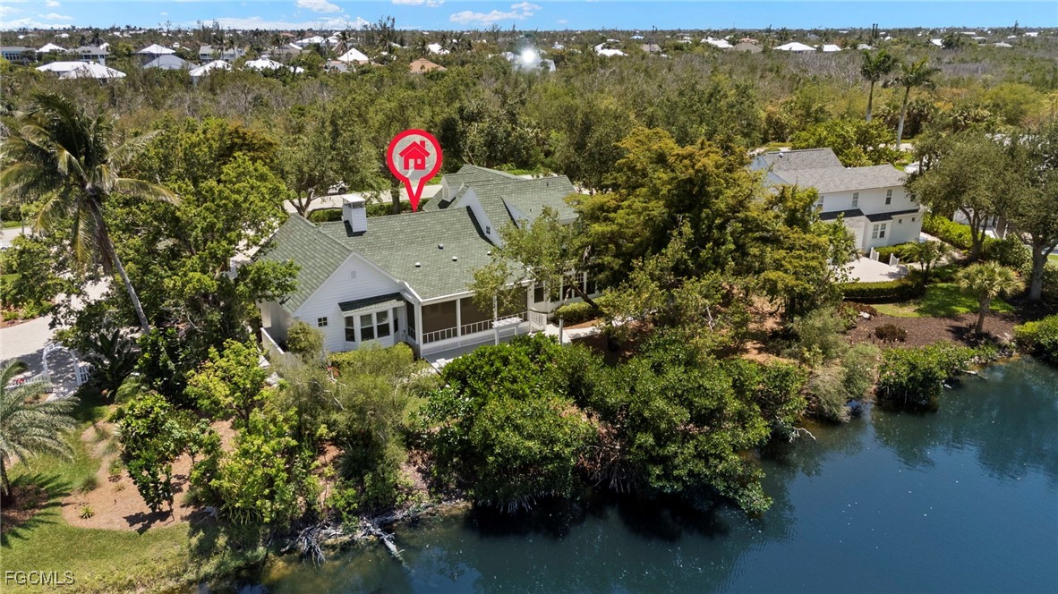 1517 Sand Castle Road Sanibel, FL 33957 - Photo 47 of 50 an aerial view of residential house with outdoor space and lake view