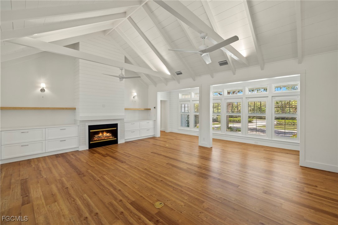 1517 Sand Castle Road Sanibel, FL 33957 - Photo 5 of 50 a view of an empty room with wooden floor and a window