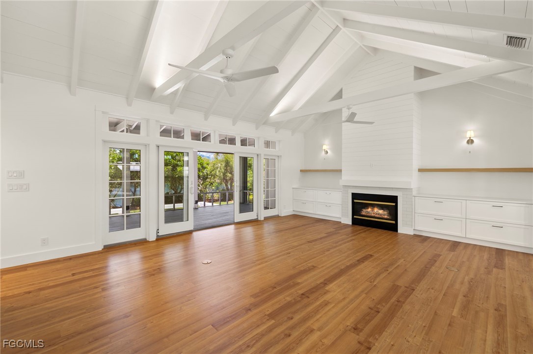 1517 Sand Castle Road Sanibel, FL 33957 - Photo 7 of 50 a view of an empty room with wooden floor and a window