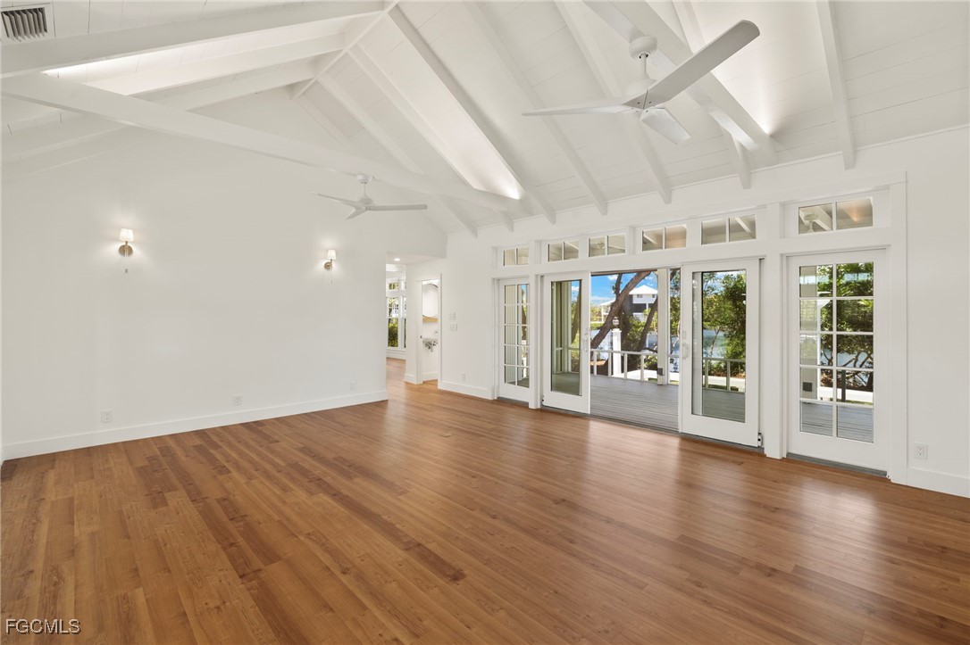 1517 Sand Castle Road Sanibel, FL 33957 - Photo 9 of 50 wooden floor in an empty room with a window