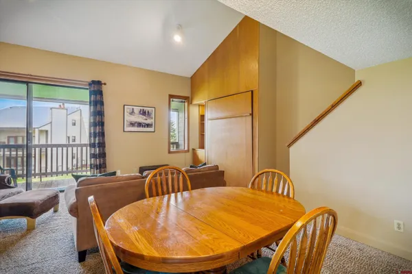 a view of a dining room with furniture